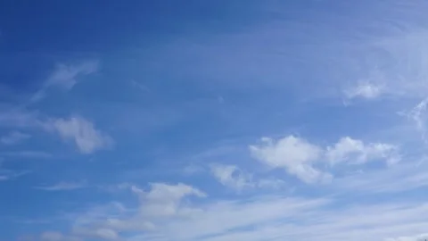 Clouds float across the blue sky. Timelapse Stock-Footage 334059463