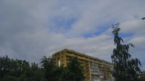 Clouds float across the sky over the house. Video stock 50676261
