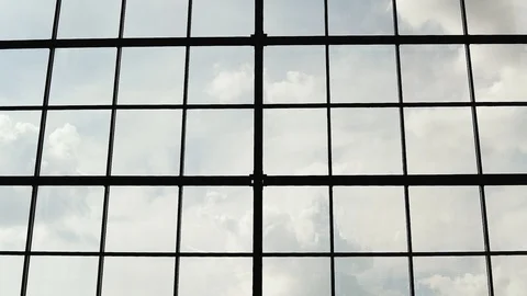 Clouds float behind a big window 库存影片 93747933