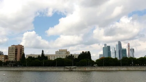 Clouds Float In The Blue Sky Over Moscow River And High Rise Buildings Moscow-Ci Stock Footage 77617543