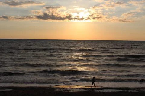 The clouds float in the evening sky. Sunset. Stock Photos
