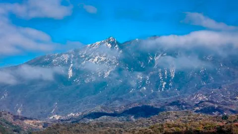 Clouds float by mountain top in Ojai California - view towards Santa Barbara, CA Stock Photos