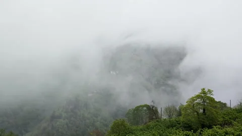 Clouds float in mountains. Fog on green hills. Stock Footage 254554266