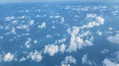 Clouds float over the blue ocean on a sunny day Fotos Stock