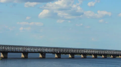 Clouds float over the bridge across the river Stock Footage 39675880