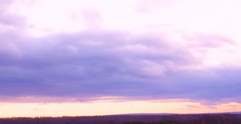 Clouds float over the forest there is a sunset Stock Footage 163635958