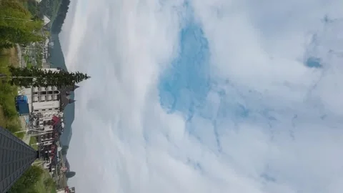 Clouds float over the houses of the Bukovel resort in autumn. Time lapse Stock Footage 251468800