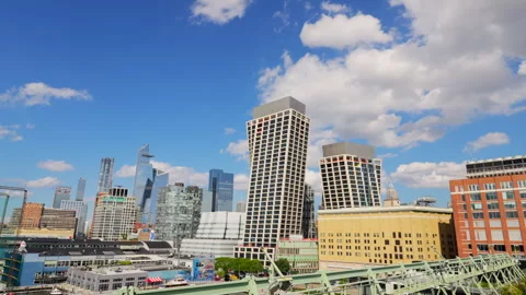 Clouds float over Hudson Yards beyond the Rooftop Park at the Pier 57 in NYC Video stock 249226265