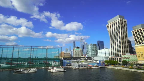 Clouds float over Hudson Yards beyond the Rooftop Park at the Pier 57 in NYC Vidéo 249689544