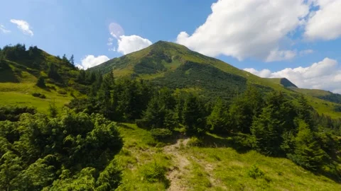 Clouds float over the mountain. TimeLapse 스톡 동영상 211100884