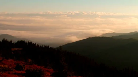 Clouds float over the mountains Stock Footage 70363588