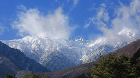 Clouds float over the mountains. Time lapse. Stock Footage 101681503