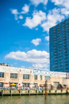 Clouds float over the Saboroso LIC restaurant at Long Island City New York. Stock Photos
