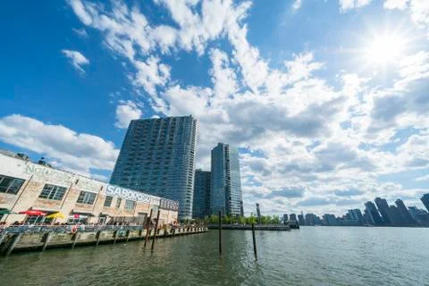 Clouds float over the Saboroso LIC restaurant  at Long Island City. Stock Photos