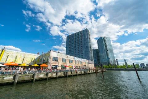 Clouds float over the Saboroso LIC restaurant  at Long Island City. Stock Photos