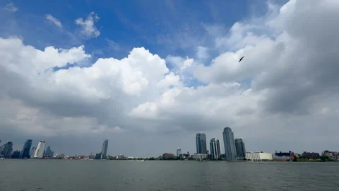 Clouds float over the skyscraper at Williamsburg at Brooklyn in New York City Stock Footage 314070695