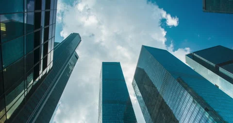 Clouds float over skyscrapers timelapse Video stock 273008201
