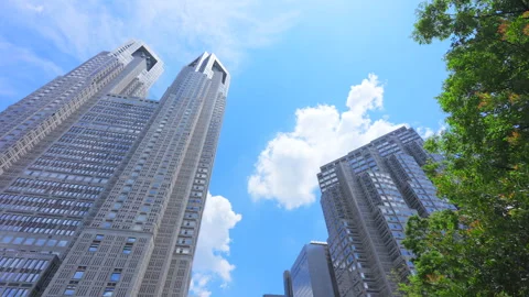 Clouds float over The Tokyo Metropolitan Government Building at Nishi-Shinjuku Stock Footage 291754394