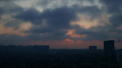 The clouds float quickly over the city, the sun breaks through the clouds Stock Footage 267094056