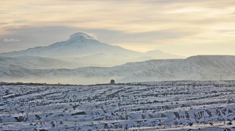 Clouds float at sunset over Cappadocia Hasan Mountain Timelaps Stock Footage 113764557