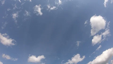 Clouds float through the blue sky on a sunny day. Timelapse. Stock Footage 127026855
