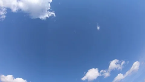 Clouds float through the blue sky on a sunny day. Timelapse. Stock Footage 127254126