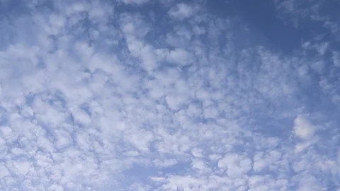 Clouds float through the sky at time lapse, spring sky with clouds Video stock 128451580
