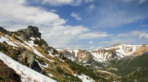 Clouds floating above the mountains with snow. Timelapse 库存影片 52316126