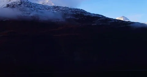Clouds floating around the snow covered mountains 스톡 동영상 79655878