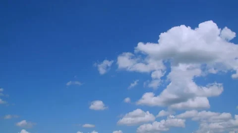 Clouds floating in a blue sky on a spring day. 4k60p Stock Footage 132219511