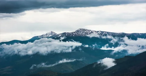Clouds floating in high mountains Stock Footage 57950650