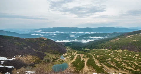 Clouds floating in high mountains Stock Footage 57950790