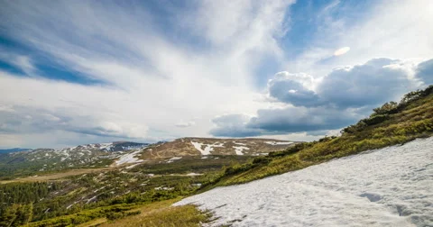 Clouds floating in high mountains Stock Footage 57951854