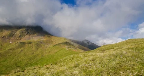 Clouds floating low over mountain meadows and lush spring alpine grass. Stock Footage 104860951