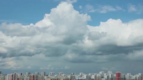 Clouds floating over a city Stock Footage 138565490
