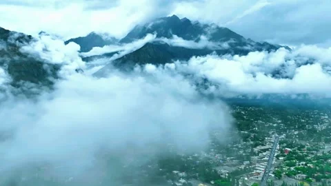 Clouds Floating Over Majestic Mountain Peaks Stock Footage 310856451