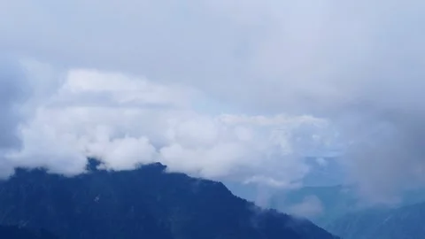 Clouds Floating Over Mountain Ridges  Dreamy Himalayan Landscape with Blue .. Stock Footage 316360977