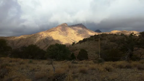 Clouds flow over Arizona Mountains in Winter Sun Stock Footage 279866847