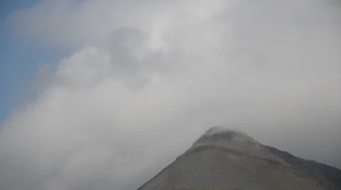 Clouds flow over mountain Stock Footage 36074006