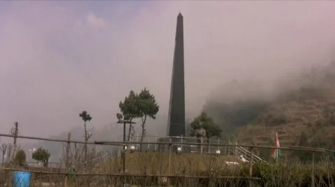 Clouds flow over the War Memorial at Darjeeling India Stock Footage 486216