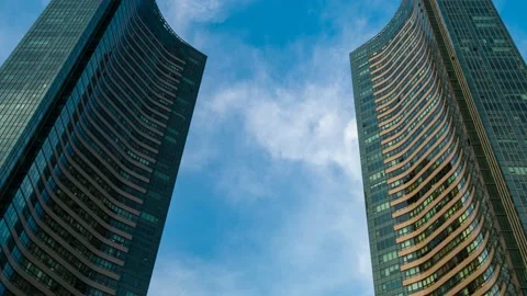 Clouds flow through high apartment complexes. 스톡 동영상 145889607