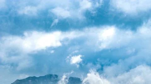 Clouds flowing over mountains. Video stock 145571905