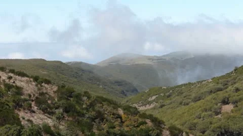 Clouds flowing over the valley. Madeira. Stock Footage 10572292