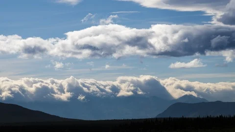 Clouds flowing over Yukon mountain range 8K time lapse Stock Footage 111358700