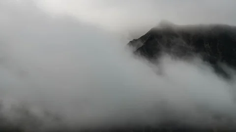 Clouds flowing over Yukon mountain range 8K time lapse Stock Footage 112296327