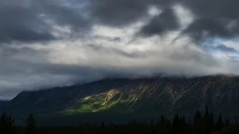 Clouds flowing over Yukon mountain range 8K time lapse Stock Footage 112298862