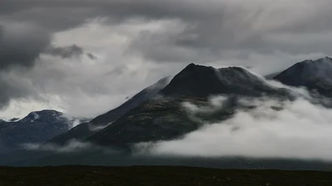 Clouds flowing over Yukon mountain range 8K time lapse Stock Footage 112482712