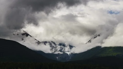 Clouds flowing over Yukon mountain range 8K time lapse Stock Footage 112484335