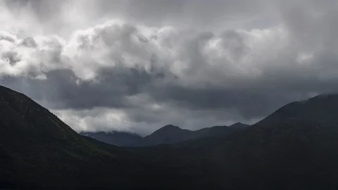 Clouds flowing over Yukon mountain range 8K time lapse Stock Footage 113973086