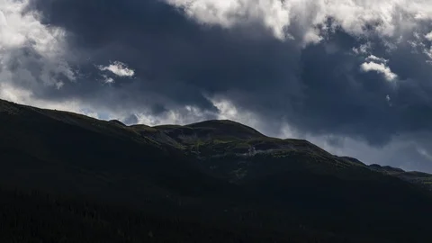 Clouds flowing over Yukon mountain range 8K time lapse Stock Footage 113994338